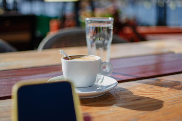 resting with coffee and putting away the mobile phone