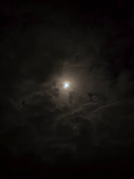 istock The moon in the night sky in cloudsbe used as background 2052712051
