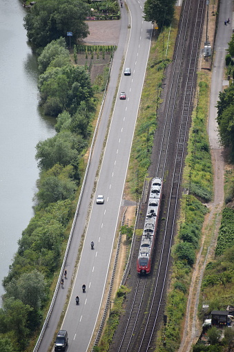 Klotten, Germany - 11/24/2022: Train, cars, bikes all side by side