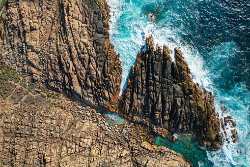 This park has several natural wonders created by the wind and the pounding waves of the Southern Ocean, such as the Gap, a spectacular channel in the 40m high coastal granites of Torndirrup National Park, where visitors can venture onto the accessible viewing platform 40m above the surging seas; Natural Bridge; and blowholes where water sprays up through the rock platform well above sea level.