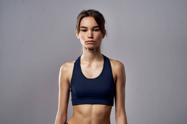 athletic woman boxing punching workout bandages dark background. High quality photo