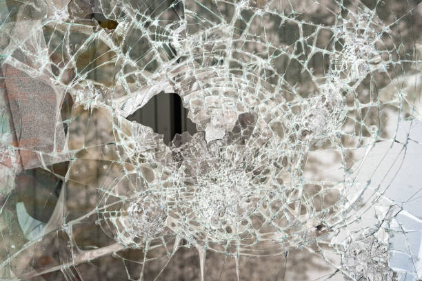 istock a broken window, a lot of cracks on the glass 2052798645