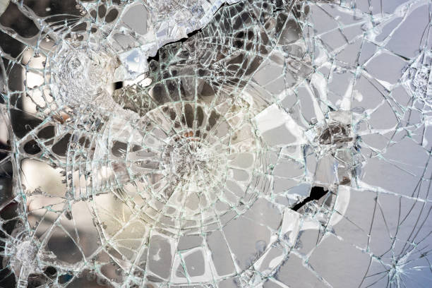 istock broken glass circular cracked lines. a crack in the glass 2052798668