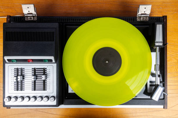 istock Vintage turntable vinyl record player with yellow vinyl 2052828047