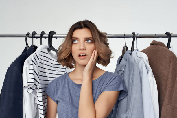 istock woman clothes fitting modern style light background 2052829156