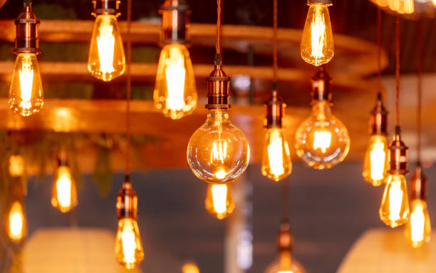 istock Decorative antique edison style filament light bulbs hanging from ceiling 2052858830