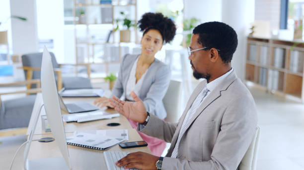 istock Man, woman and office with computer, discussion and collaboration for strategy, team and plan. Business partners, conversation or brainstorming for project, company or agency for happy, smile or job 2052859905