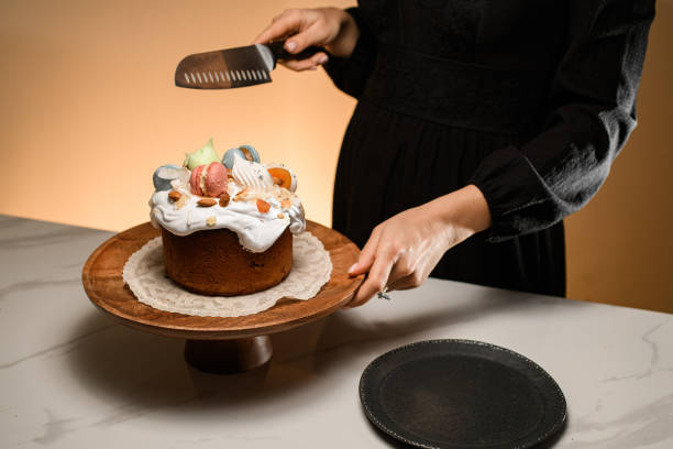 istock Girl cutting Easter on a rustic wooden stand 2052860428
