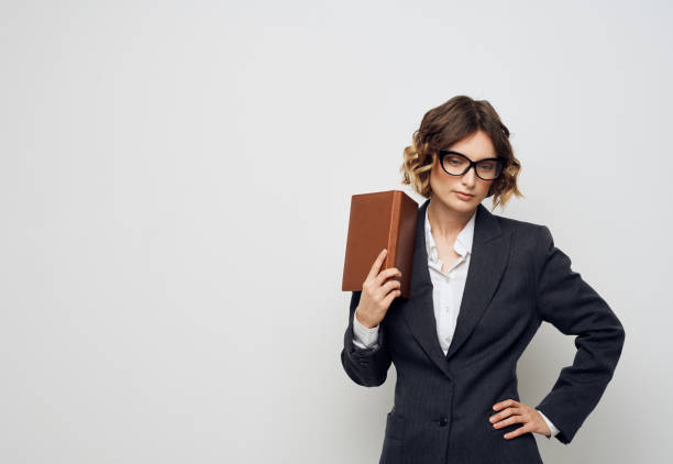 istock Woman with documents in hands classic suit and glasses hairstyle 2052861536