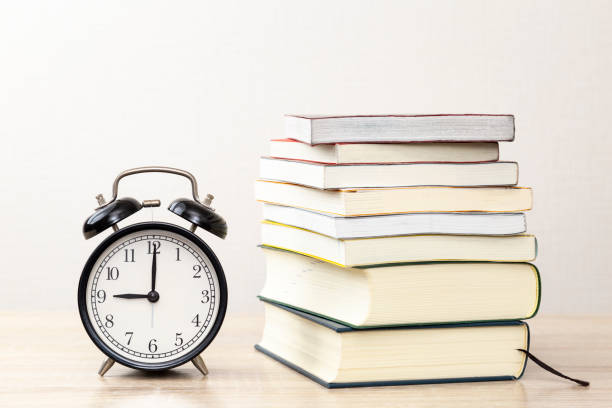 istock A stack of books and an alarm clock. 2052864689