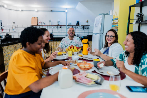 istock Friends talking and eating on hotel restaurant 2052867039