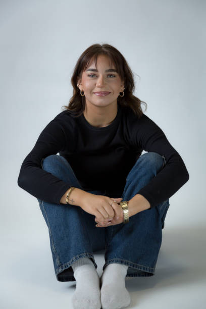A young teenage, studio shoot on white background