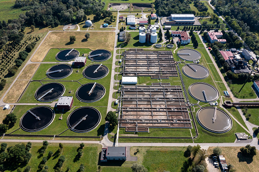 A large industrial water purification plant surrounded by green areas seen from above.