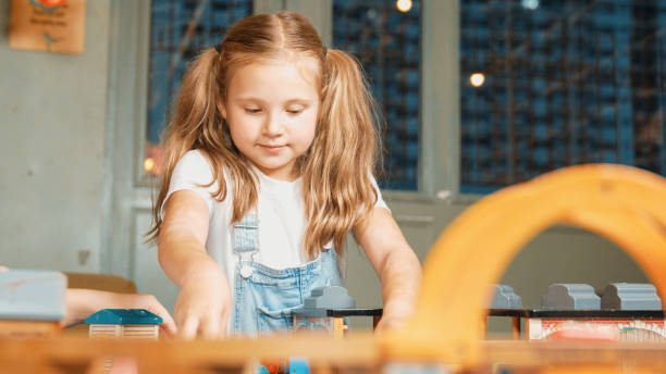 istock Multicultural girl playing toy to improve and develop creativity. Erudition. 2052886082
