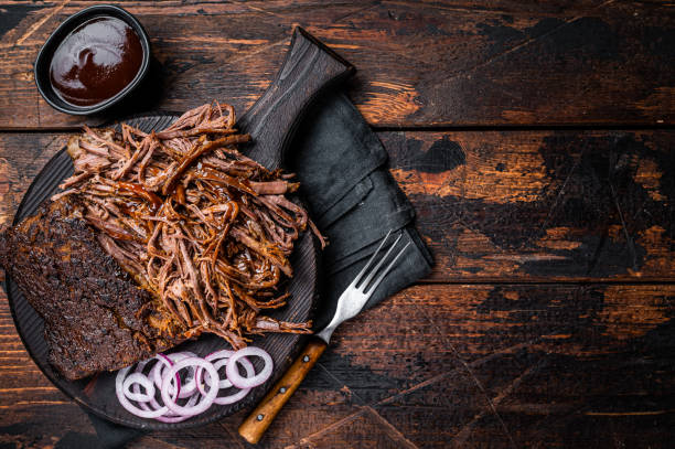 istock Traditional barbecue wagyu pulled beef on wooden board. Wooden background. Top view. Copy space 2052890826
