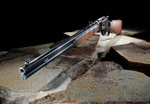 istock Rifle that is a lever action outdoors on stones 2052895065