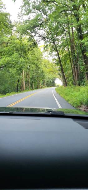 istock Curving highway driving on a foggy fall day 2052917491