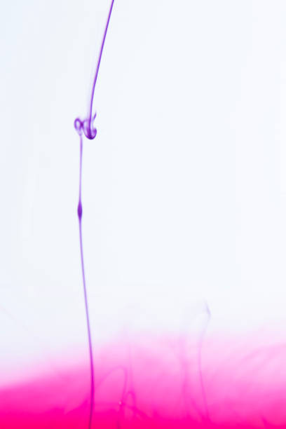 This photograph was created by dropping paint into water. before disintegrating into strange, beautiful shapes