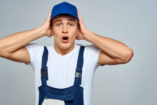 istock working man in uniform service lifestyle delivery service light background 2052931583