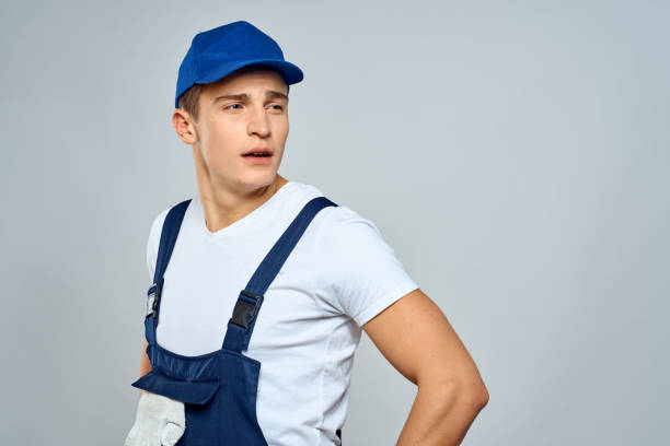 istock working man in uniform service lifestyle delivery service light background 2052932628