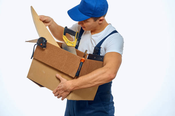 istock A man in a working uniform with a box in his hand loading a delivery service 2052934702