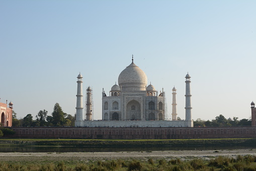 Taj Mahal, mausoleum complex in Agra, western Uttar Pradesh state, northern India. The Taj Mahal was built by the Mughal emperor Shah Jahān (reigned 1628–58) to immortalize his wife Mumtaz Mahal (“Chosen One of the Palace”), who died in childbirth in 1631, having been the emperor’s inseparable companion since their marriage in 1612. India’s most famous and widely recognized building, it is situated in the eastern part of the city on the southern (right) bank of the Yamuna (Jumna) River. Agra Fort (Red Fort), also on the right bank of the Yamuna, is about 1 mile (1.6 km) west of the Taj Mahal.