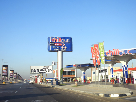 Cairo, Egypt, December 16 2023: Chillout airport gas and oil station at the daytime, a petrol gas station near Cairo airport with circle K stores, McDonald's and B. Tech inside the station, selective focus