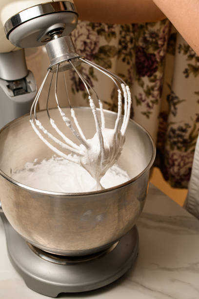 istock Crafting Fluffy Homemade Whipped Cream. Step by Step Journey 2052946714