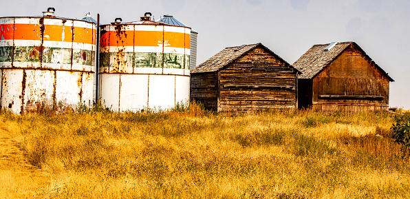 A fall drive thru Wheatland County past rustic buildings and farm fields, Alberta, Canada