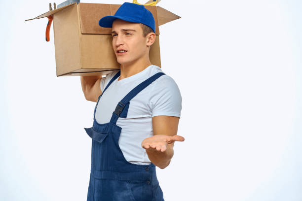 istock A man in a working uniform with a box in his hand loading a delivery service 2052951442