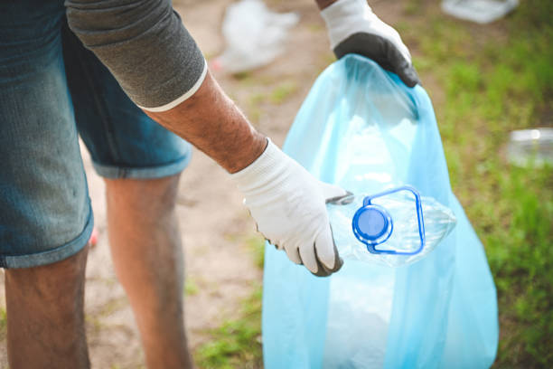 istock male volunteer collecting garbage in the forest 2052959280