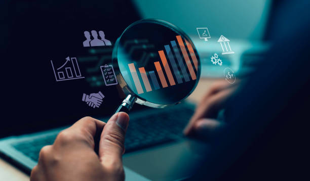 istock business target A magnifying glass on cooperation concept, financial growth, strategy, investment, success, and achieving new heights in the market. 2052993305