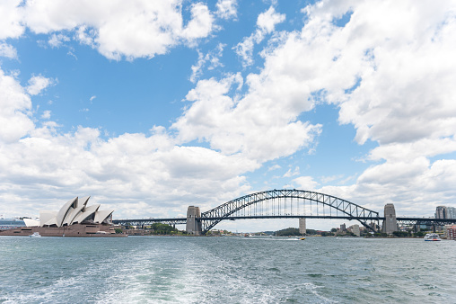 Sydney Opera House and Harbour Bridge. Photo from the Ferry. Australia, Cloudy Sky