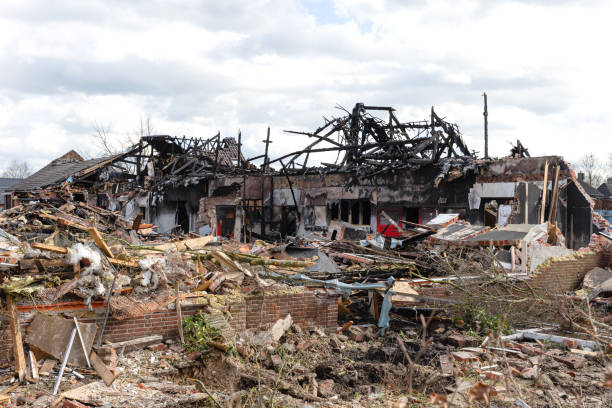 Remainings of a collapsed stone building after being completely destroyed from a fire the night before, some parts of the construction are still standing (brick walls)