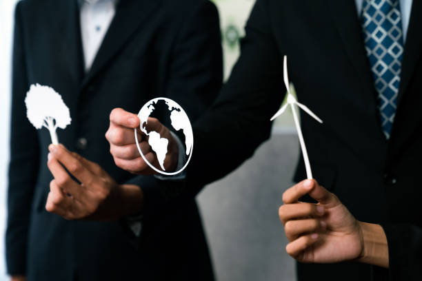 istock Group of business people holding alternative net zero energy icon. Quaint 2053055400