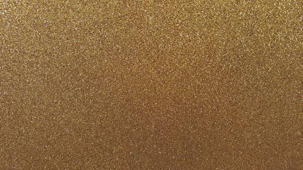 istock Gold color textured bright glowing background set 2053058562