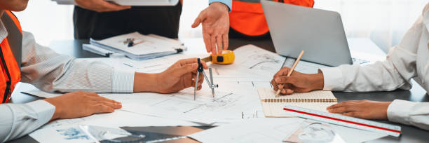 istock Architect or engineer working on building blueprint in office. Insight 2053071158