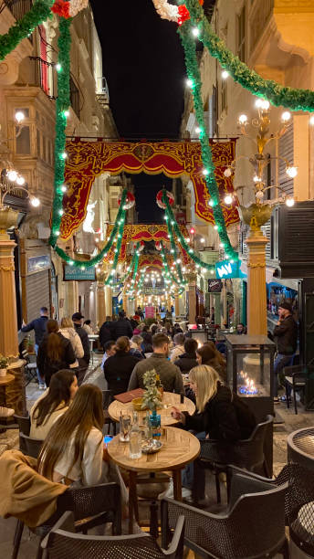 Dining at night in a street in Malta stock photo