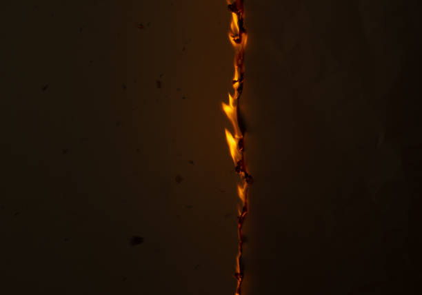 A minimalist photograph capturing an orange wall illuminated by a light source, creating a gradient effect from bright to dark. The shadow adds depth and contrast, evoking a serene and contemplative mood. Suitable for artistic projects focusing on color theory, lighting effects, or abstract design.