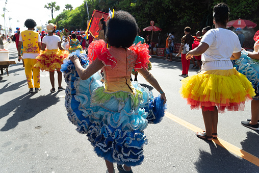 Salvador, Bahia, Brazil - February 03, 2024: People from cultural groups are seen dancing during the Fuzue pre-carnival parade in the city of Salvador, Bahia.