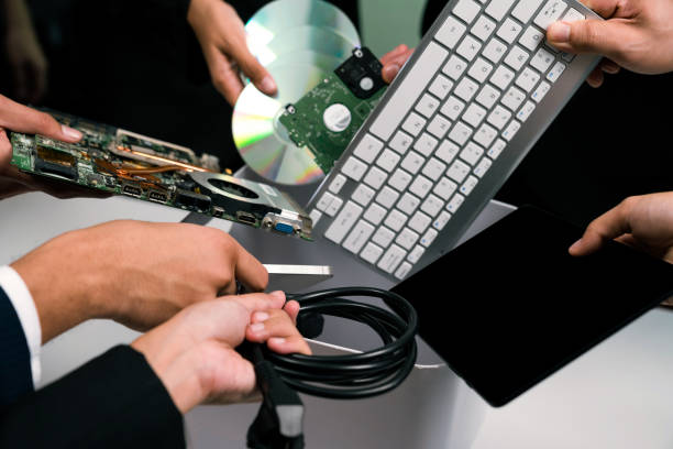istock Business people holding electronic waste on isolated background. Quaint 2053132656