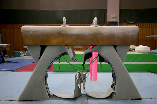 Focus on pommel horse in gymnasium for gymnastic artistic