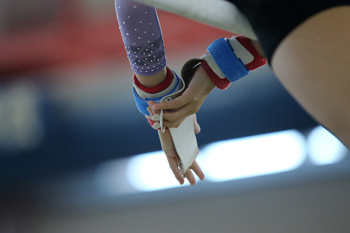 Focus on gymnast's hands
