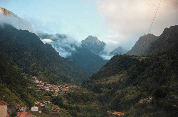 istock Magical valley landscape, clouds on peaks in the Madeira Island 2053144029