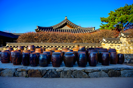 Traditional Korean house with clay jars lined up at the folk village park in Seoul, South Korea