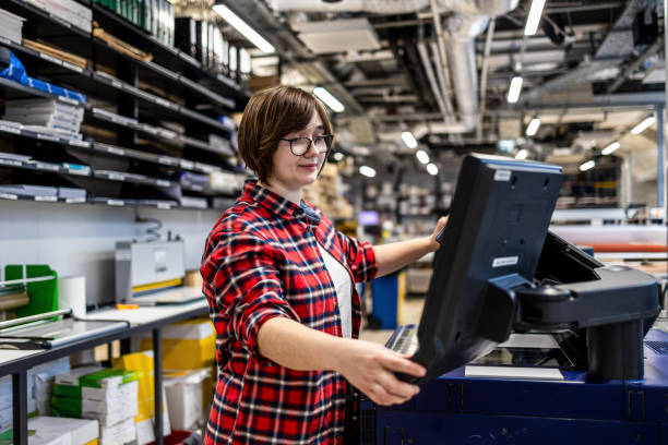 istock Woman working in a printing factory 2053181769