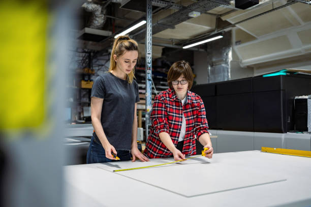 istock Professional female employees working in a printing house 2053181772