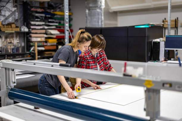 istock Professional female employees working in a printing house 2053182344