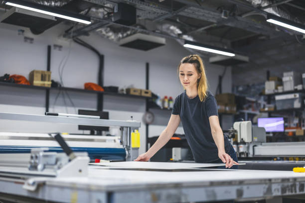 istock Woman working in a printing factory 2053182346