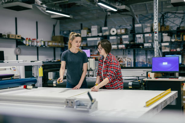 istock Professional female employees working in a printing house 2053182348